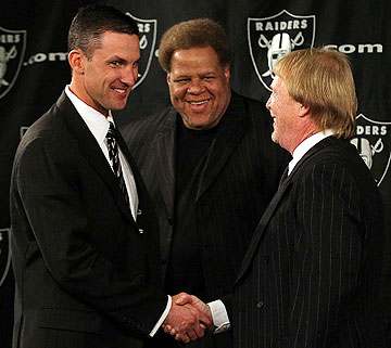 Dennis Allen (left) had been a defensive coordinator for one season before Reggie McKenzie (center) and Mark Davis hired him in January 2012. (Justin Sullivan/Getty Images)
